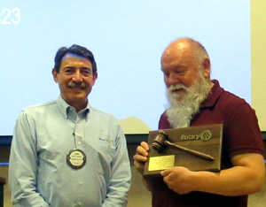 Ludtke (left) receives plaque for year of service